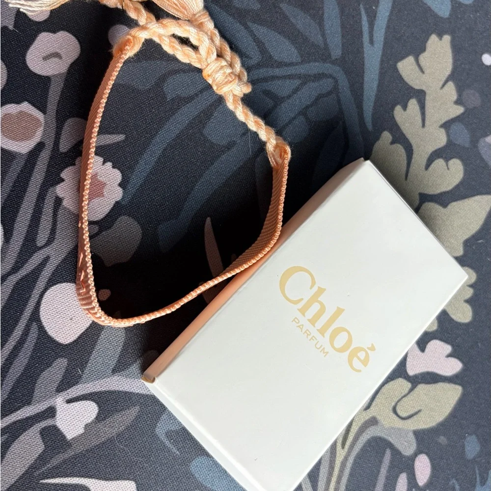 Chloé Authentic “I AM CHLOE”Parfum Peach Woven Tassle Adjustable Bracelet (BNIB) - Picture 6 of 6